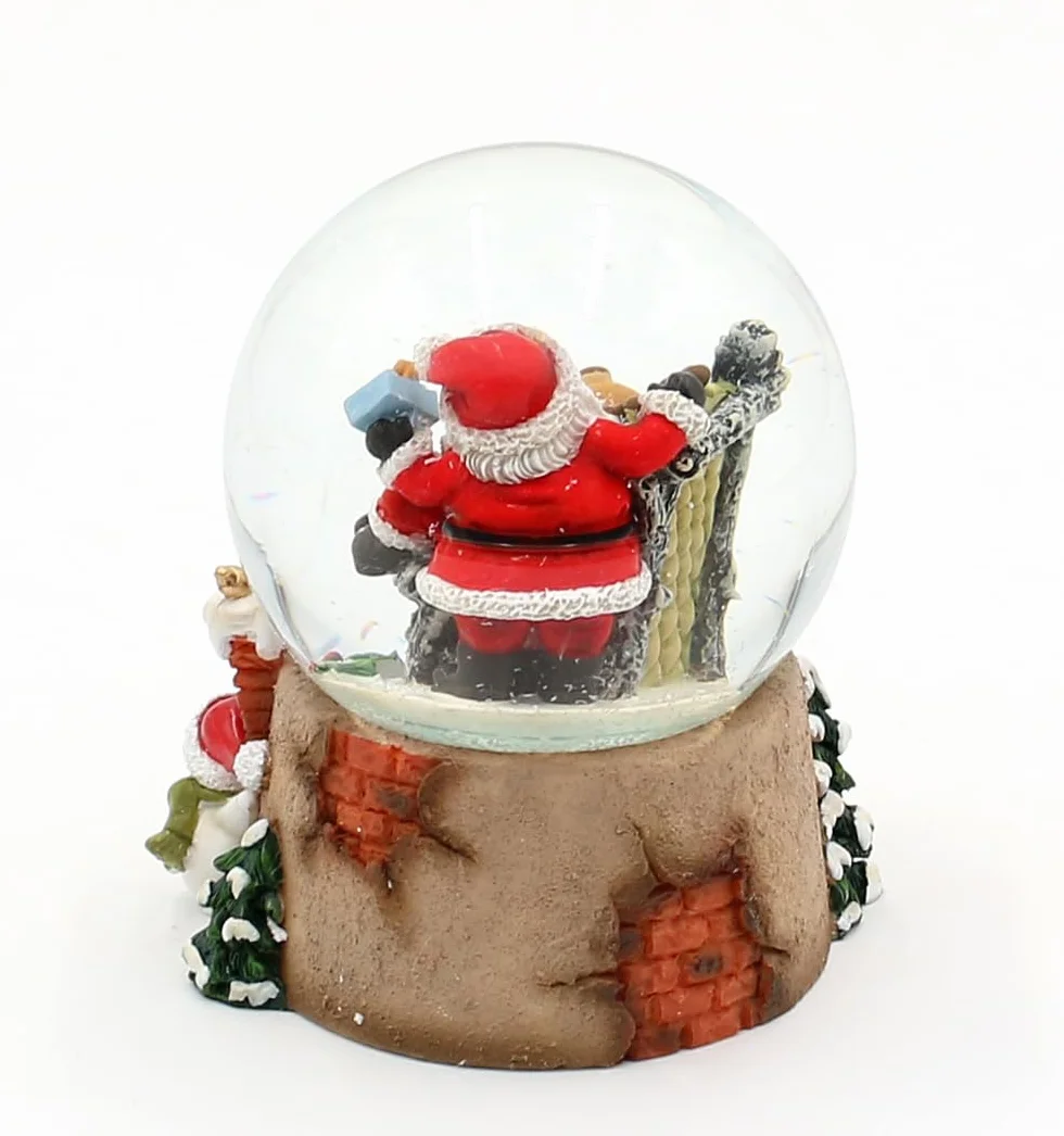 Kula śnieżna renifer w fotelu Święty Mikołaj 8 x 7 x 8,8 cm Ø 6,5 cm